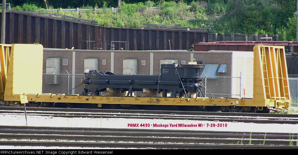 P+H Harnischfeger component rides a company bulkhead flat